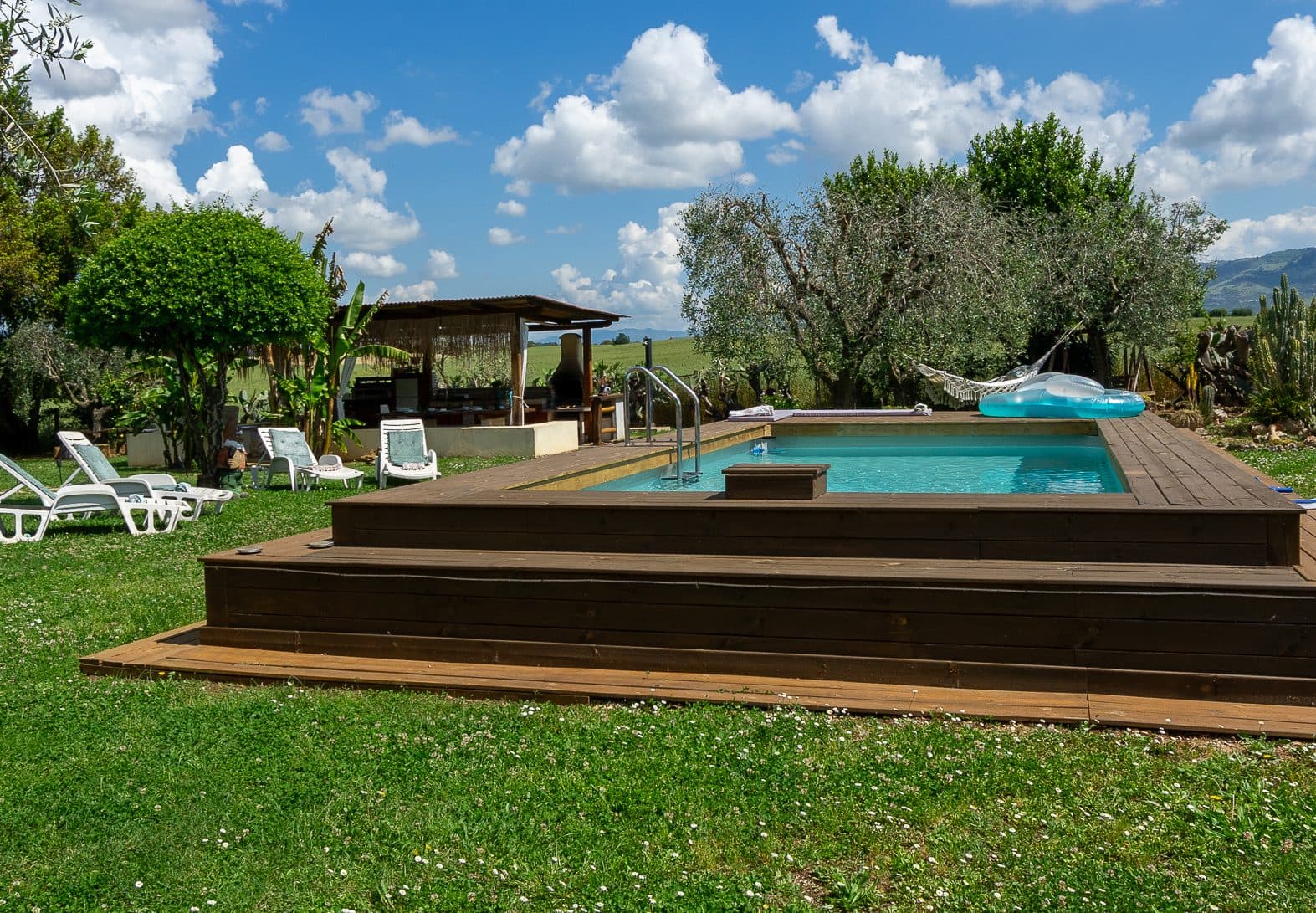 Private pool surrounded by the garden