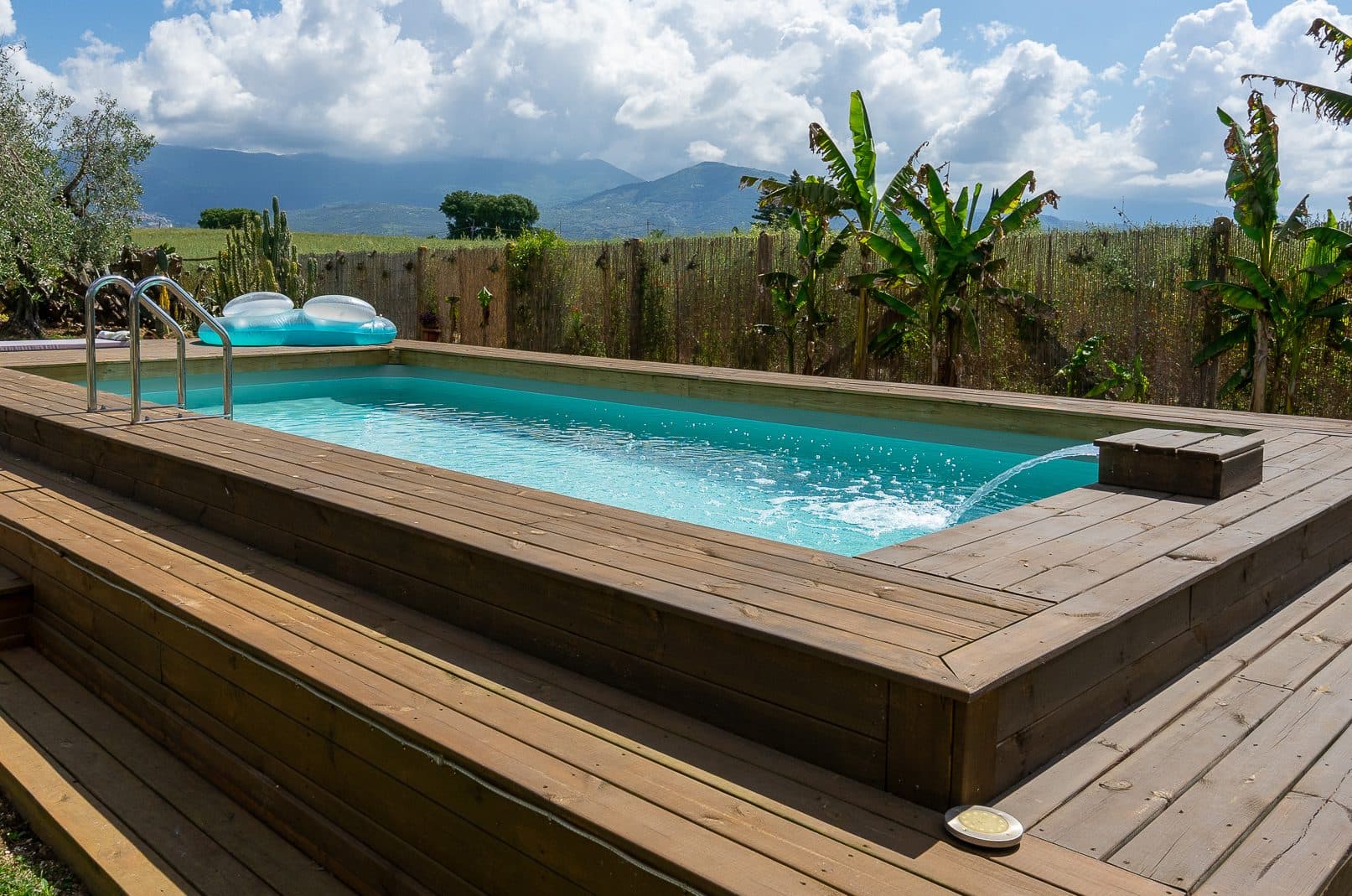 Private pool surrounded by the garden